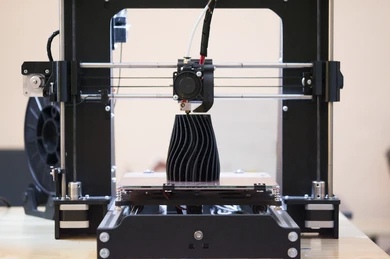 The process of working 3D printer and creating a three-dimensional object. 