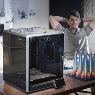 A compact silent 3D printer integrated into a clean, modern European home office workspace