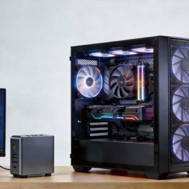 Mini PC and desktop tower placed side by side on a modern desk, highlighting size and form factor differences in 2026.