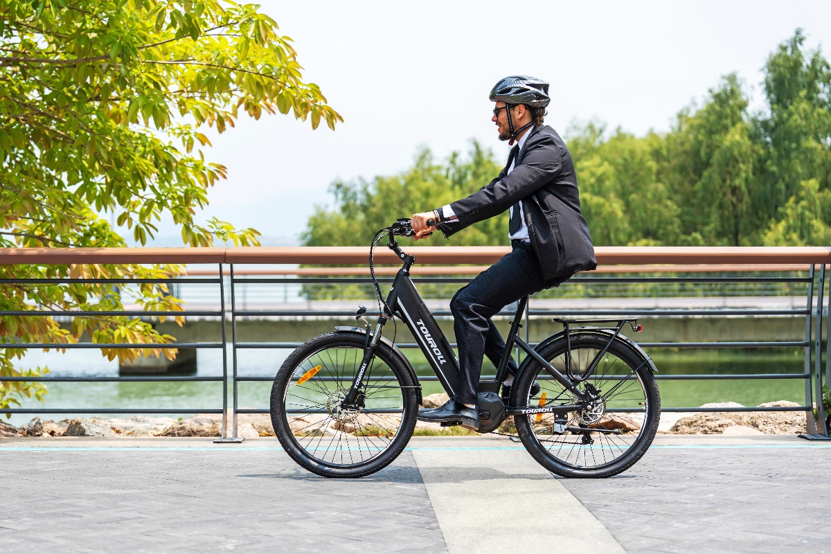 Office worker using an e-bike for active commuting in 2026