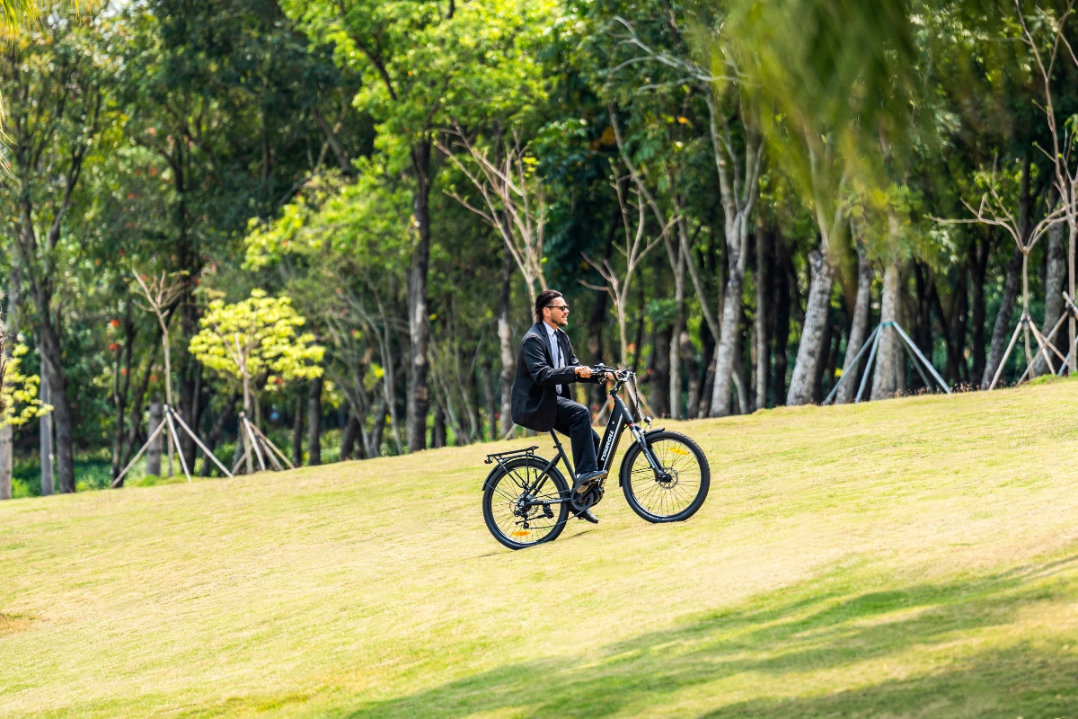E-bike rider confidently climbing an urban hill without excessive effort
